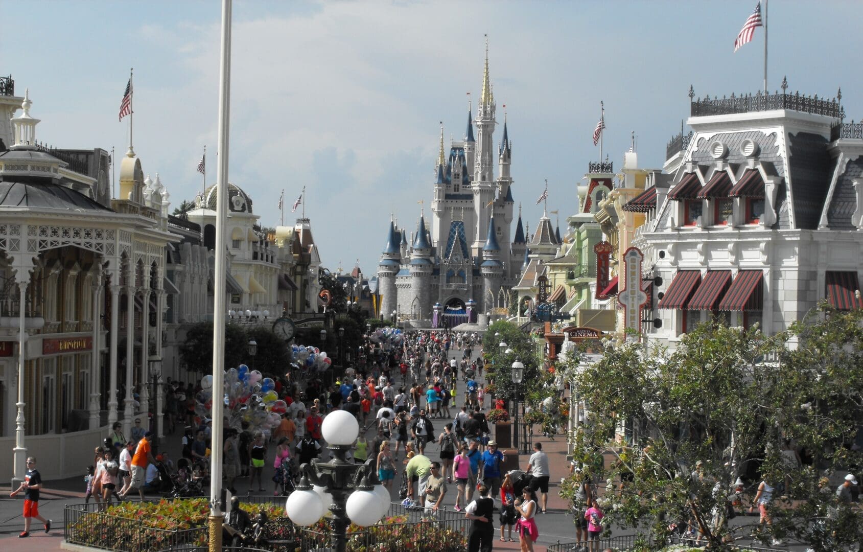 A crowd of people walking down the street.