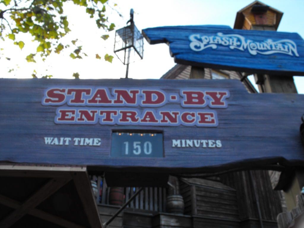 A sign that says stand by entrance and reads " stand by entrance ".