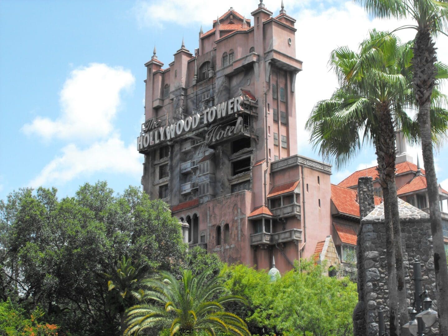 A very tall building with many windows and trees