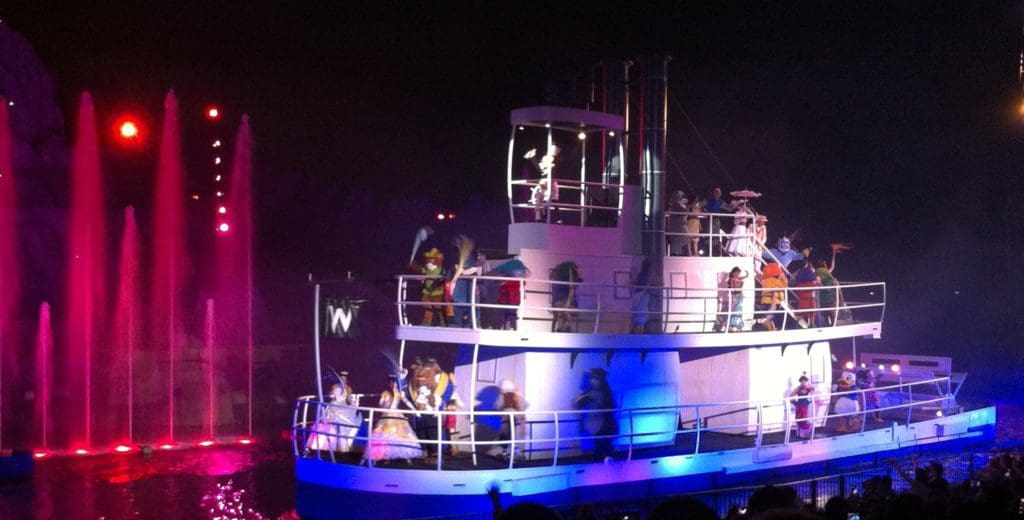 A boat with people on it at night.