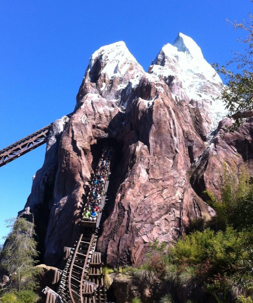 A mountain with a roller coaster going up it