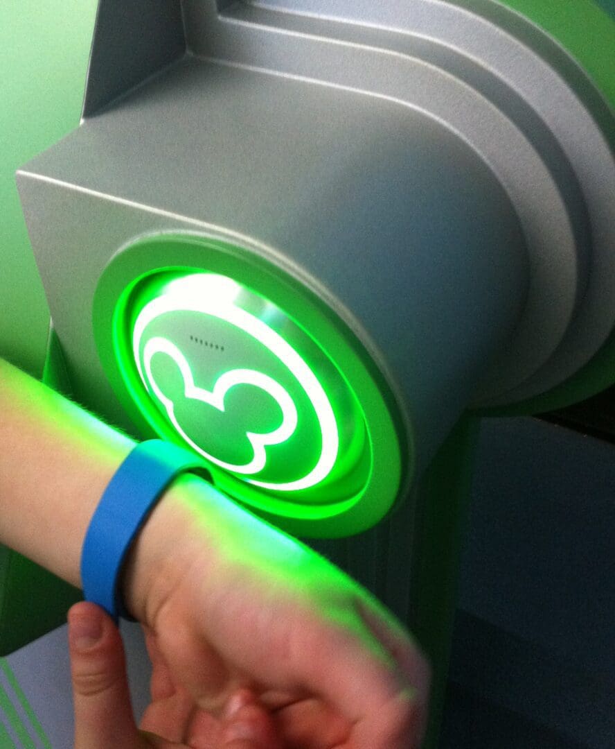 A person is touching the green light on their wrist.
